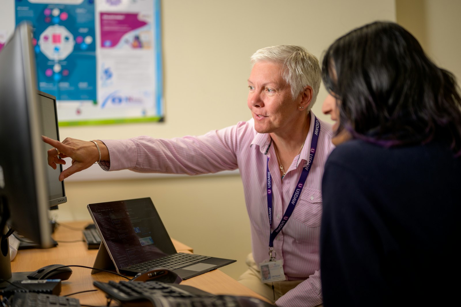 IT engineer walking a life sciences client through a system on screen